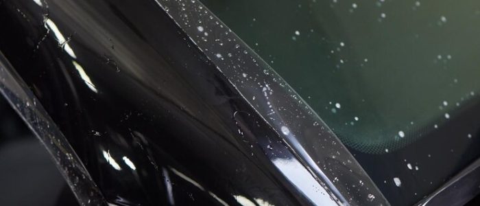 worker-applies-protective-film-antigravity-protective-coating-car-headlight-details-car_152904-44613